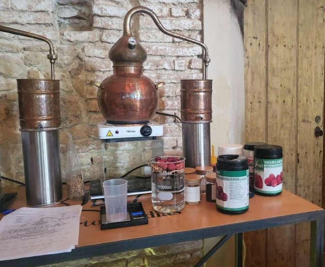 Copper still with spirit and botanicals