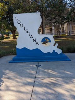 Welcome to Louisiana sign in front of their Visitor Center on I-10